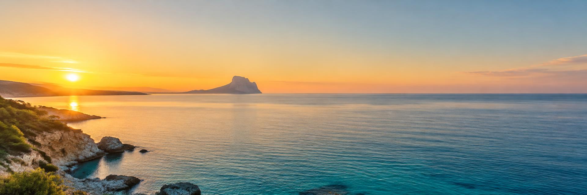 Mediterranean coast with the Peñón de Ifach at sunset