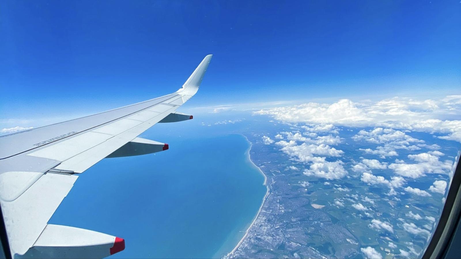 View from the plane window arriving on the coast