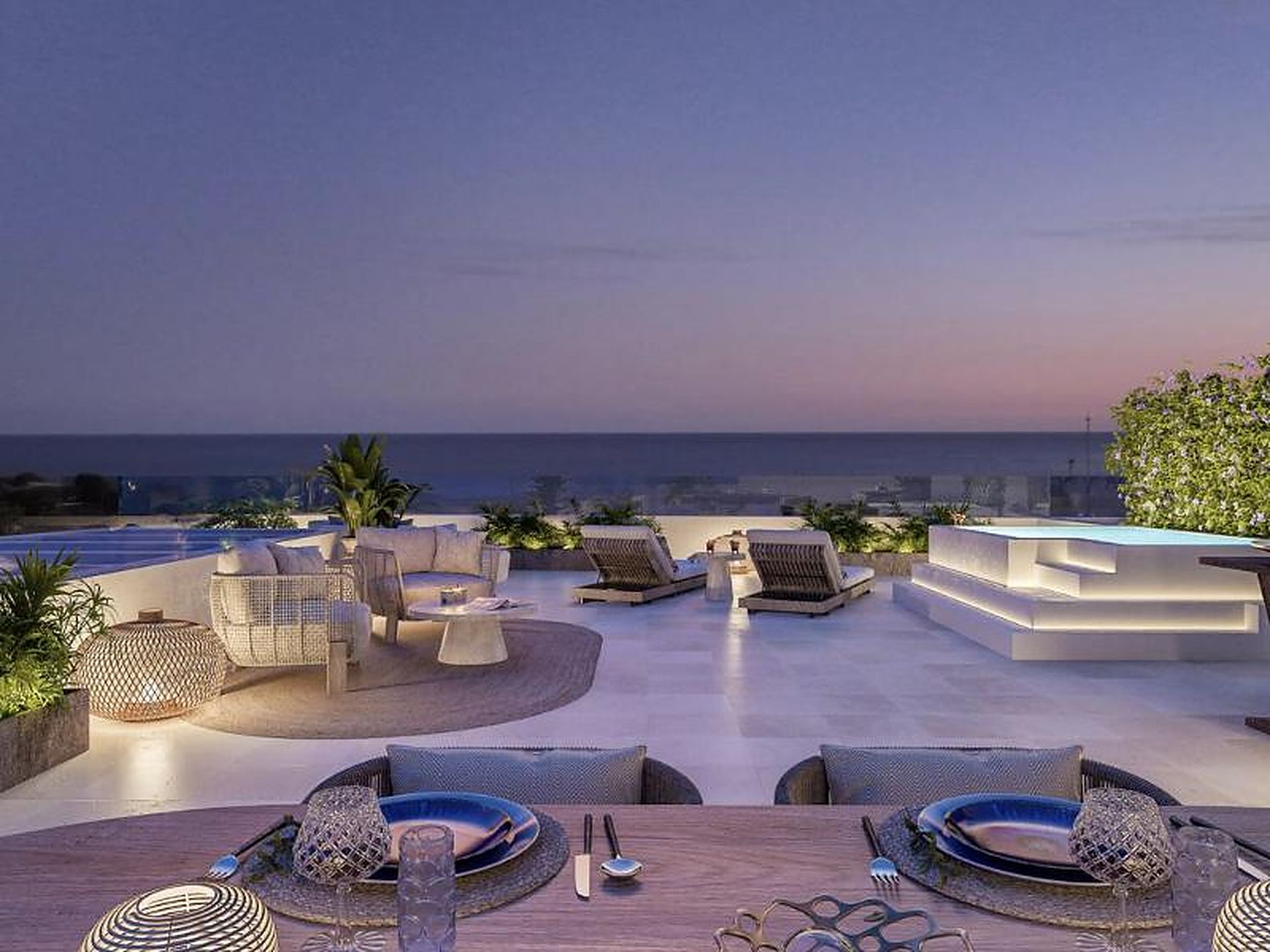 Terrace of a new-build home at sunset, with sea views
